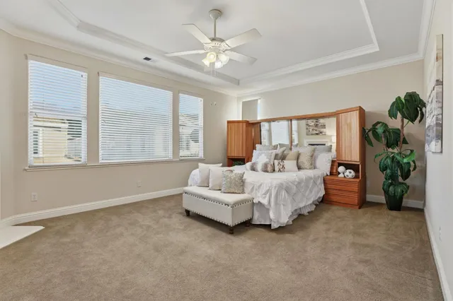 a spacious bedroom with a large bed and a fireplace