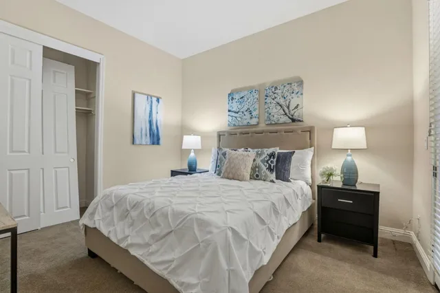 a bedroom with a bed and window