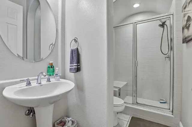 a bathroom with a double vanity sink mirror and