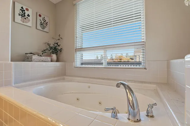 a bathroom with a double vanity sink and mirror