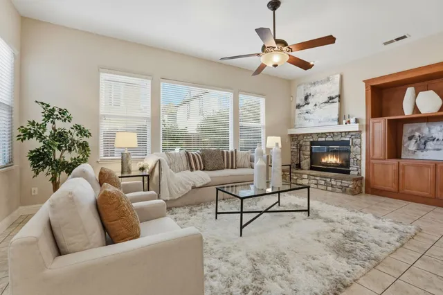 a living room with furniture and a fireplace