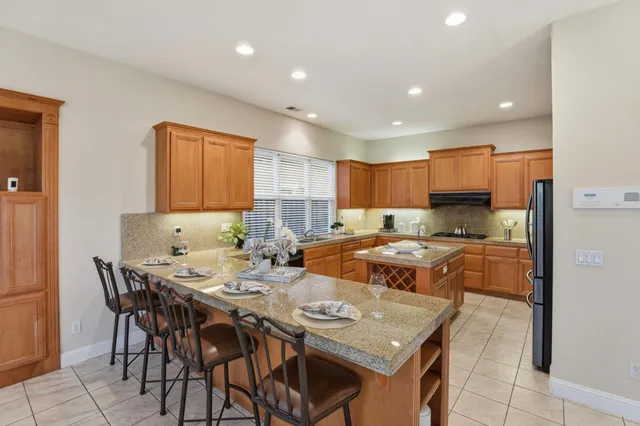 a kitchen with a table and chairs in it