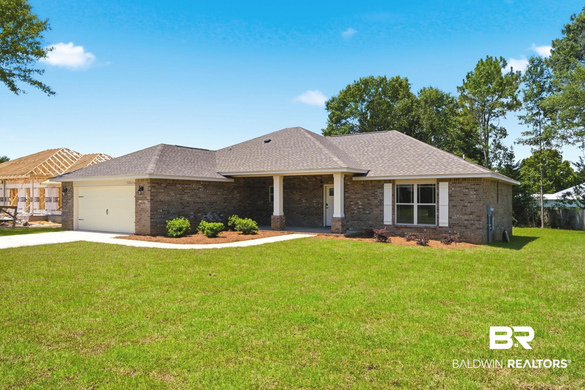 32656 Arbor Ridge Circle Lillian, AL 36549 - Photo 56 of 56 Contemporary brick-clad residence featuring a hip roof and an integrated two-car garage