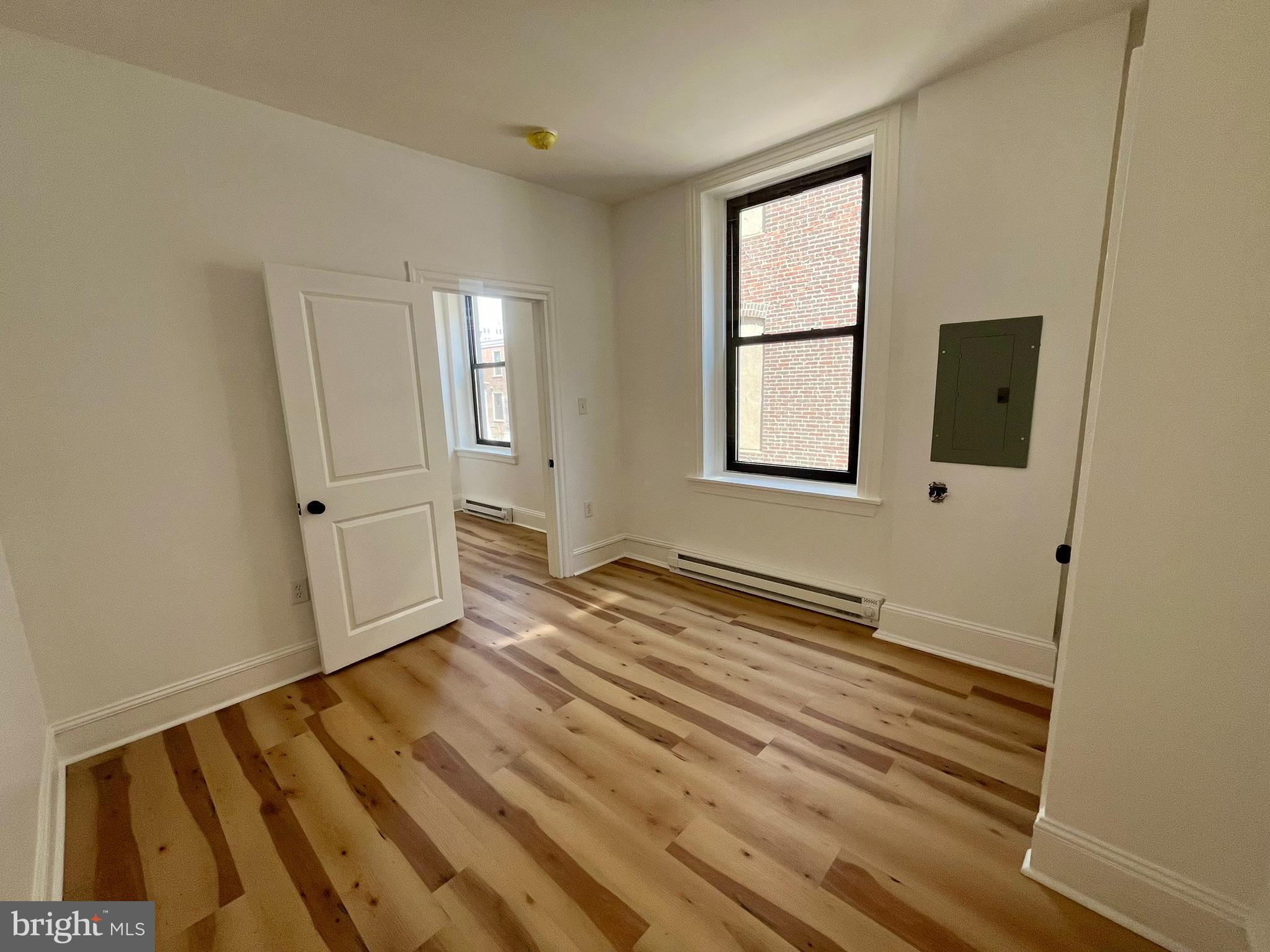4413 Walnut Street, Unit 2R Philadelphia, PA 19104 - Photo 12 of 18 an empty room with windows
