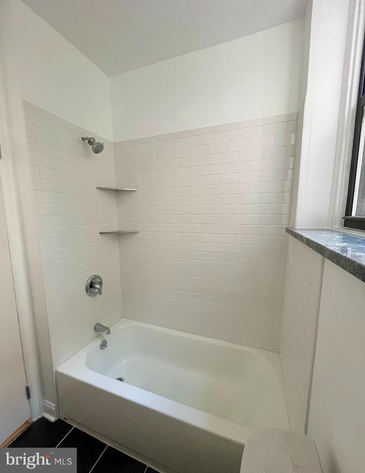 4413 Walnut Street, Unit 2R Philadelphia, PA 19104 - Photo 16 of 18 a bathroom with a bathtub and a shower