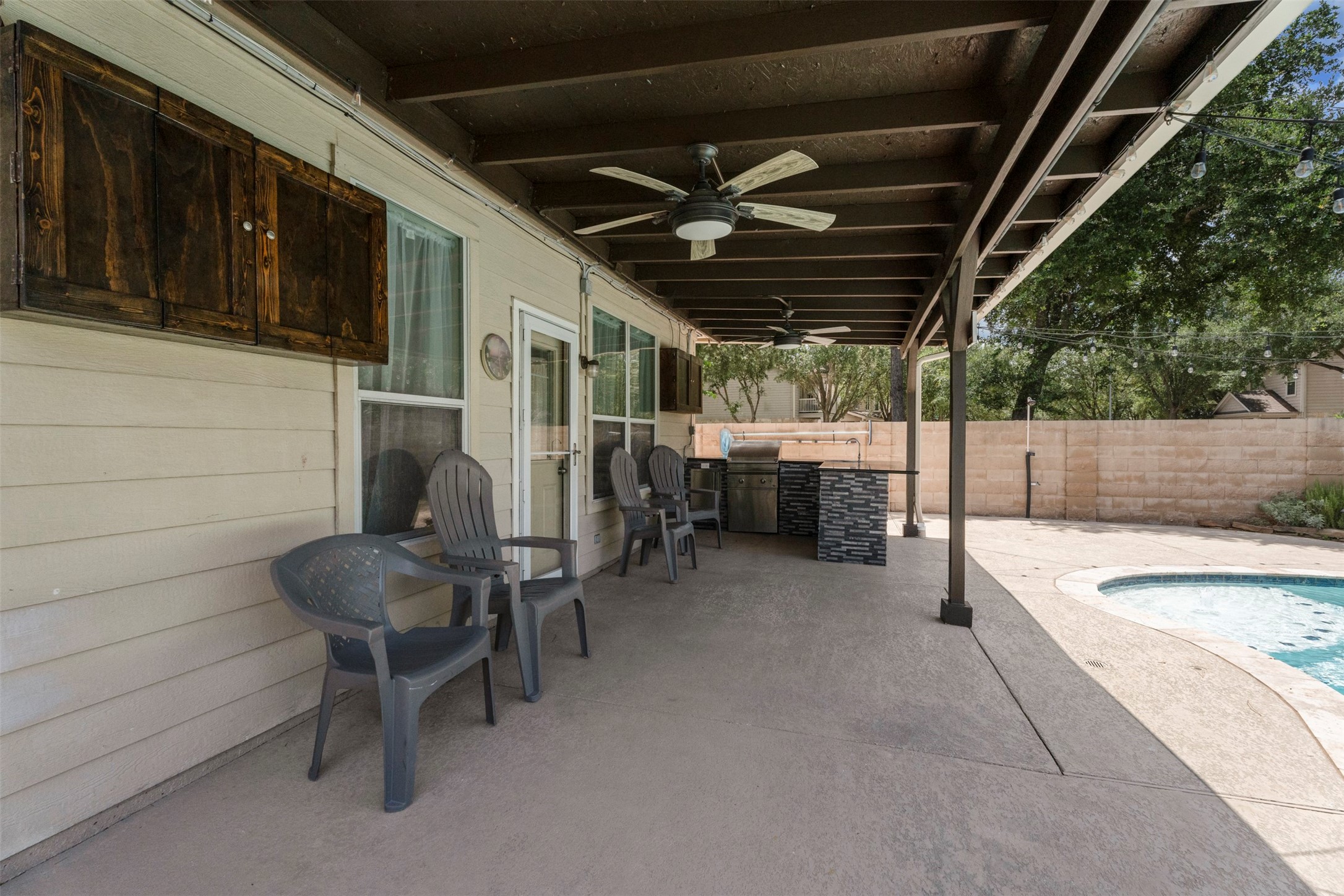 3530 Azalea Sands Drive Spring, TX 77386 - Photo 33 of 34 Very spacious covered patio with outdoor kitchen, great storage and ceiling fan.