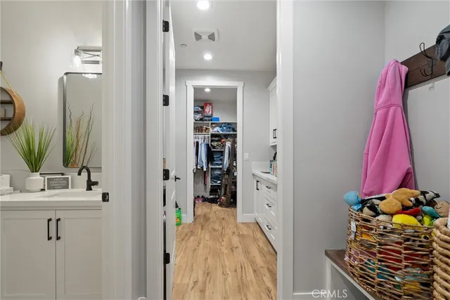 a bathroom with a sink mirror and vanity