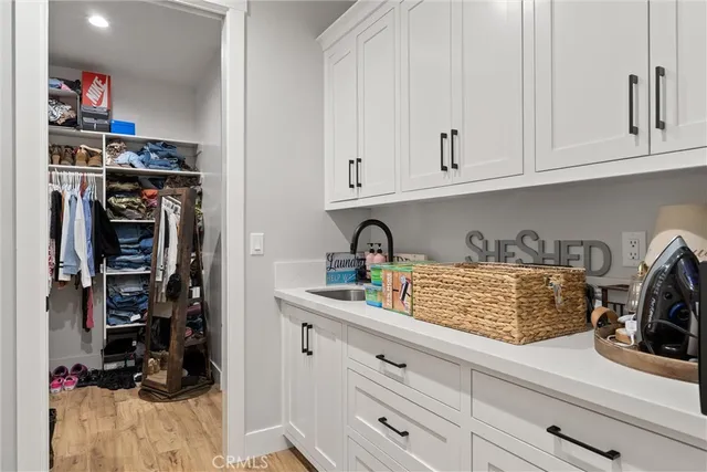 a view of a kitchen with appliances and cabinets