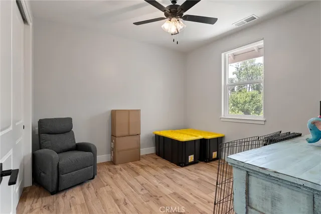 a bedroom with furniture and a window