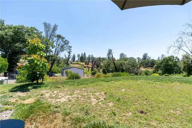 a view of backyard with outdoor space