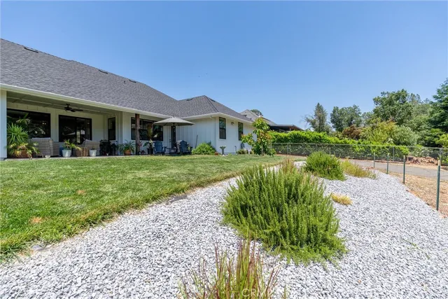 a view of a garden with a building in the background