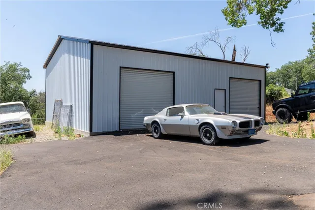 a view of car parked in front of a house