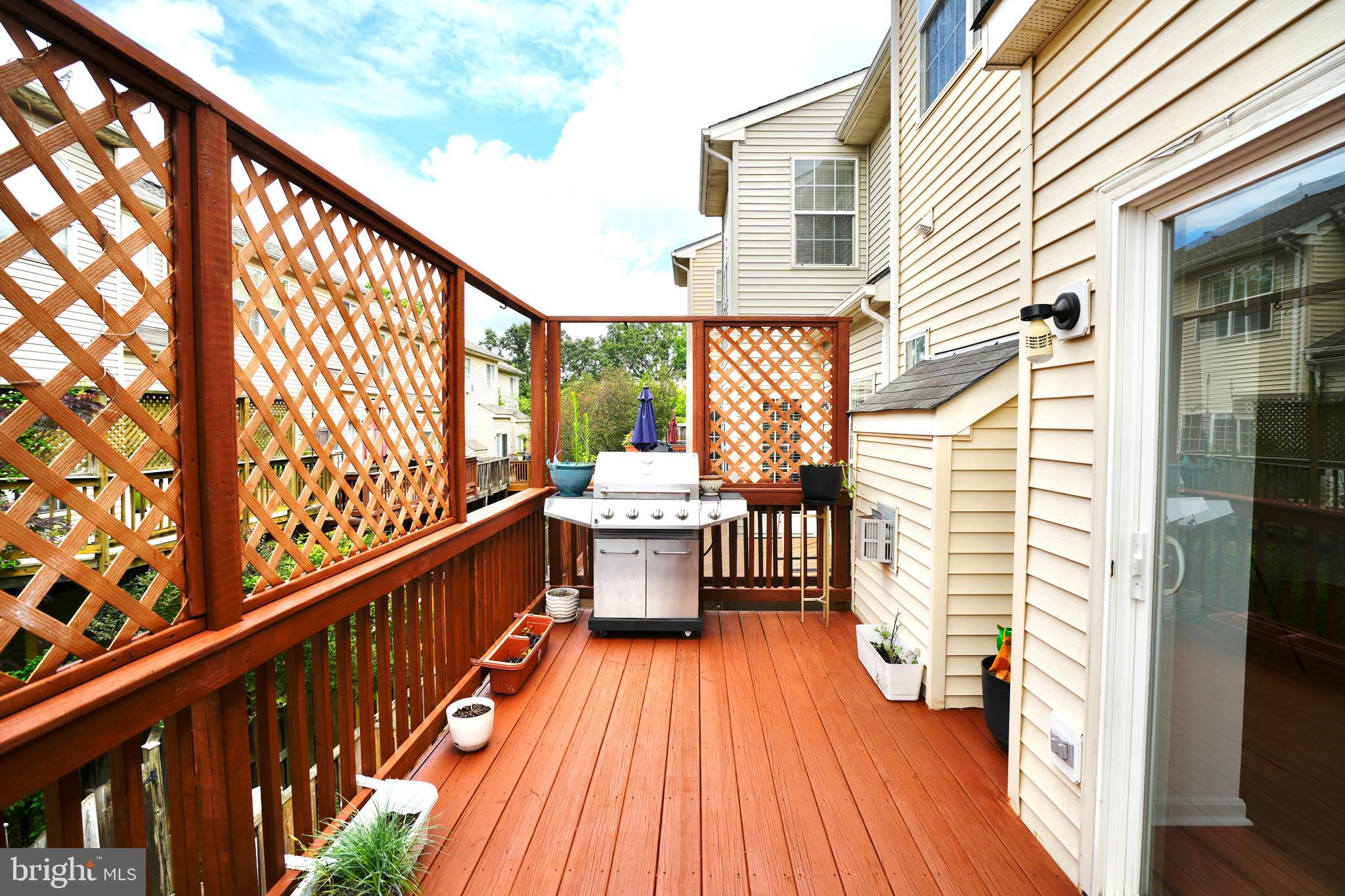 6688 Roderick Loop Gainesville, VA 20155 - Photo 12 of 40 a view of a balcony with wooden floor