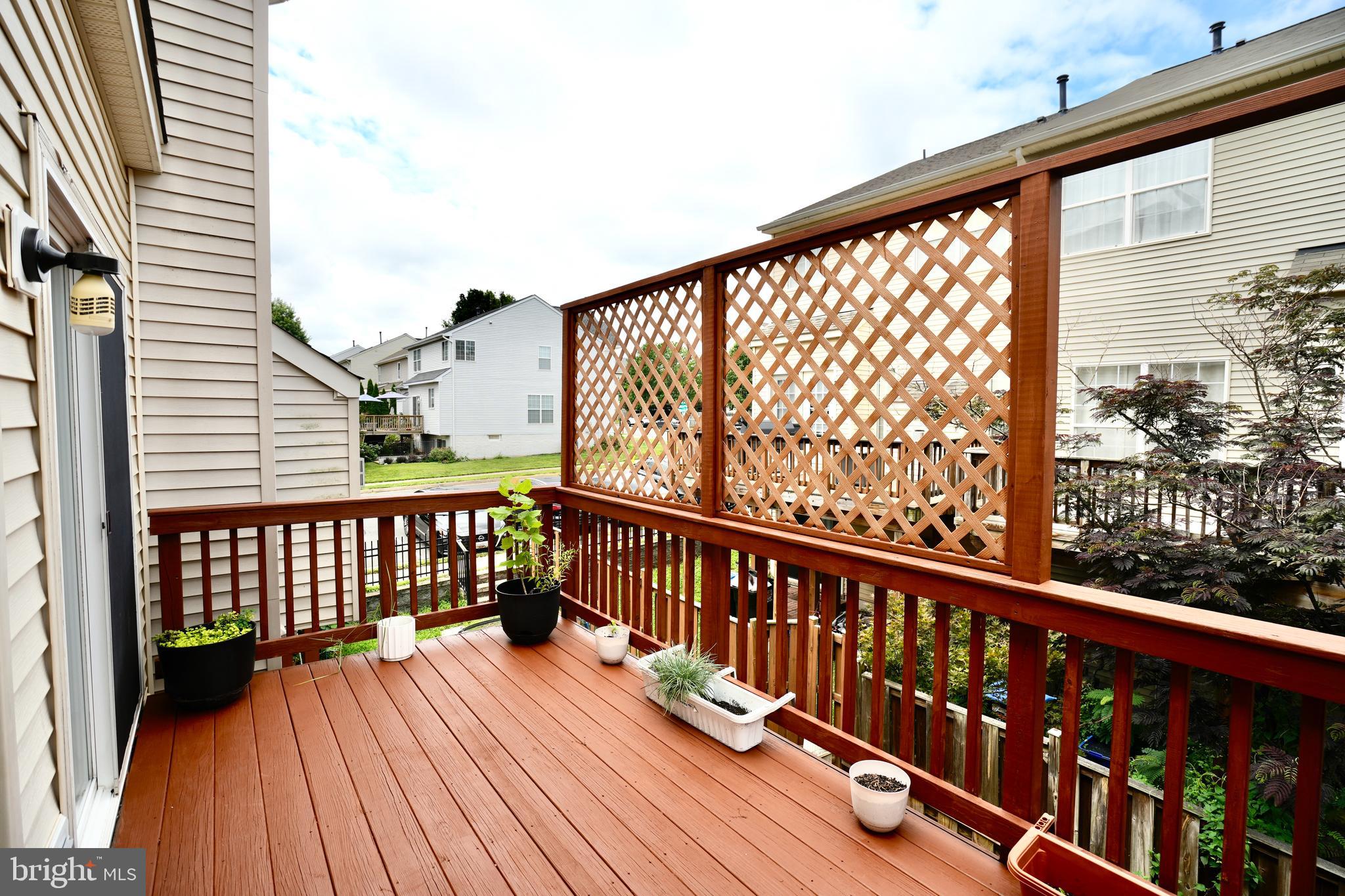 6688 Roderick Loop Gainesville, VA 20155 - Photo 13 of 40 a view of balcony with wooden floor