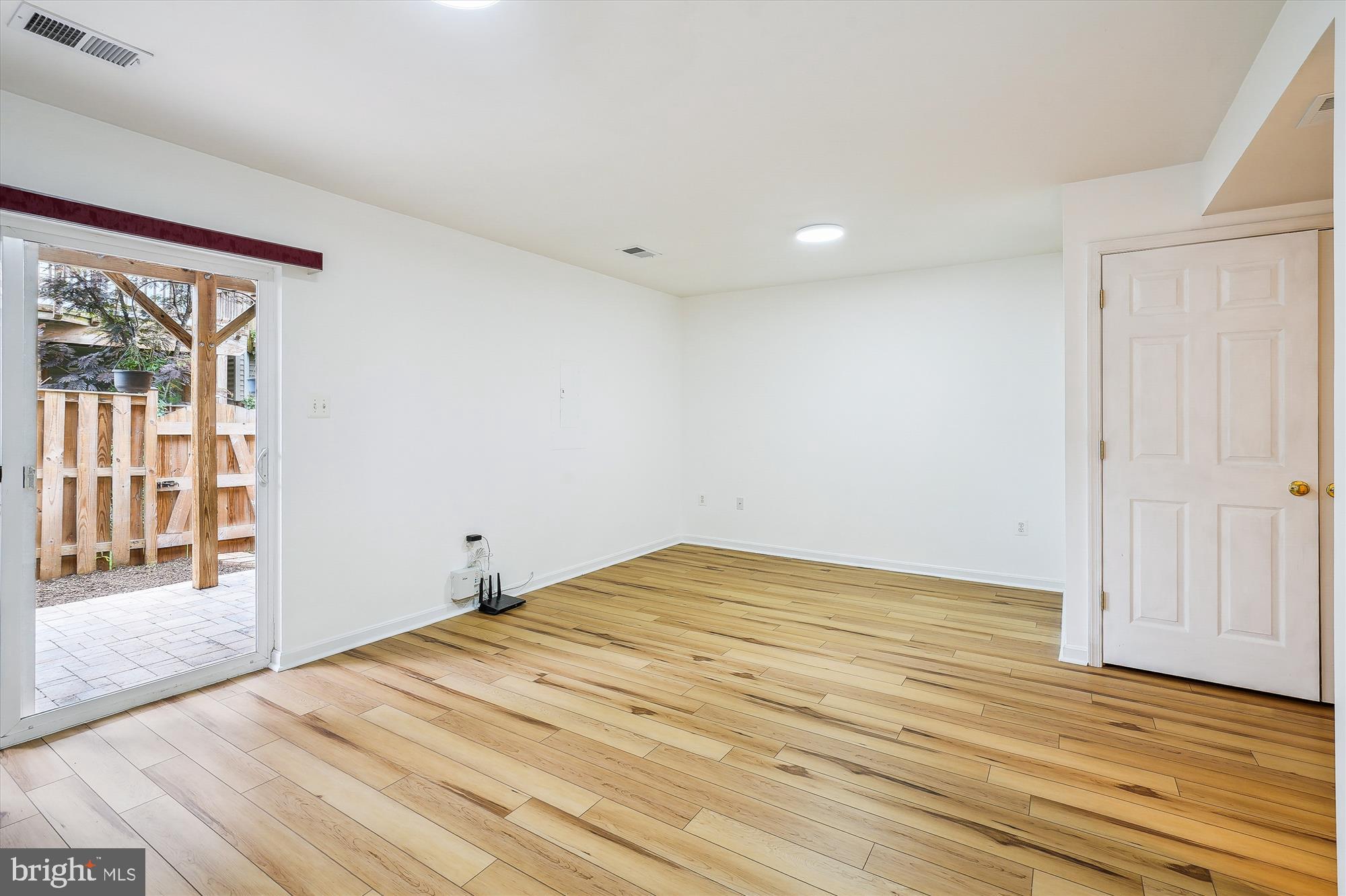 6688 Roderick Loop Gainesville, VA 20155 - Photo 27 of 40 a view of empty room with wooden floor and fan