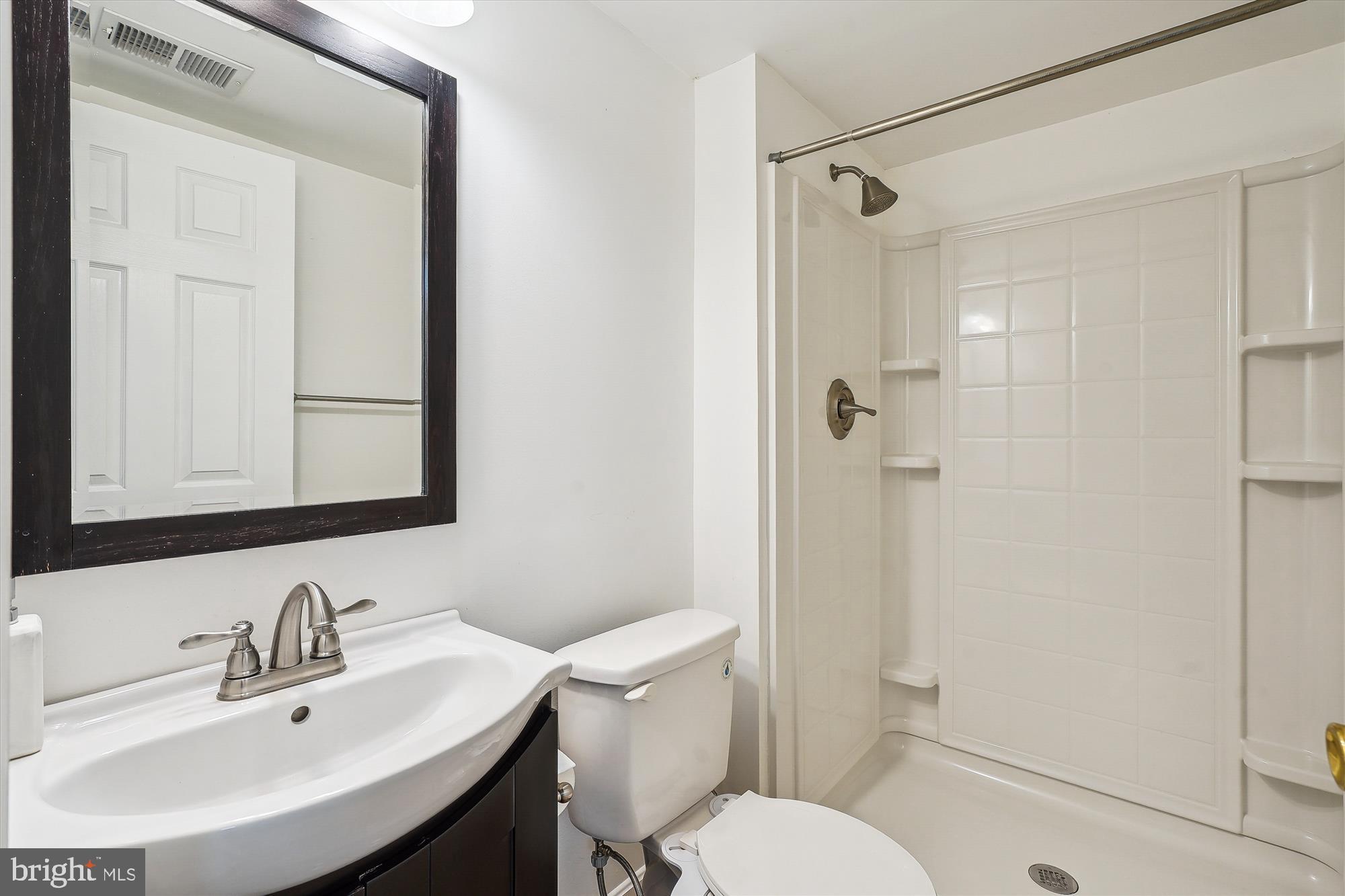 6688 Roderick Loop Gainesville, VA 20155 - Photo 28 of 40 a bathroom with a sink toilet and shower