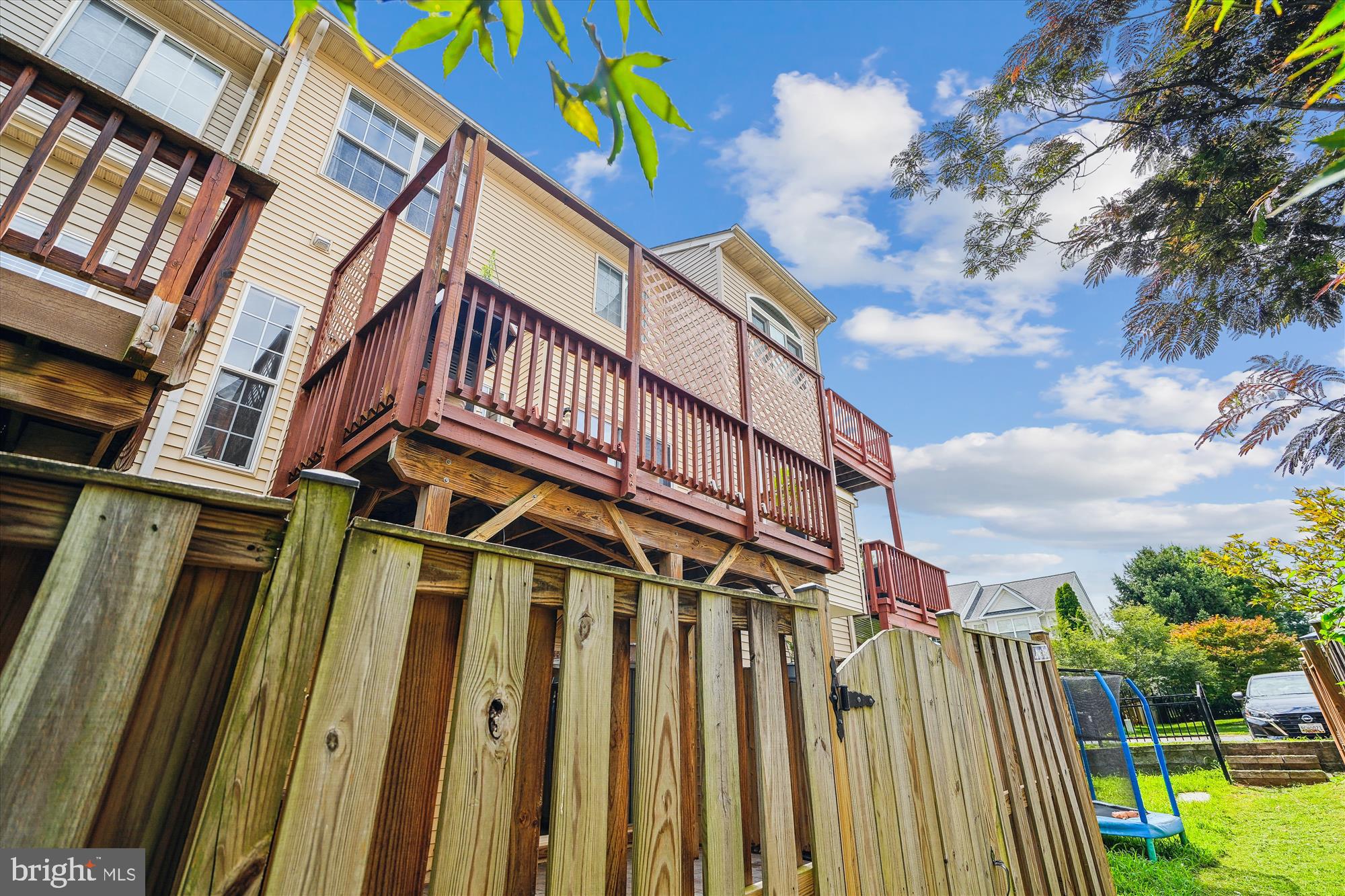 6688 Roderick Loop Gainesville, VA 20155 - Photo 30 of 40 a front view of a building with a garden