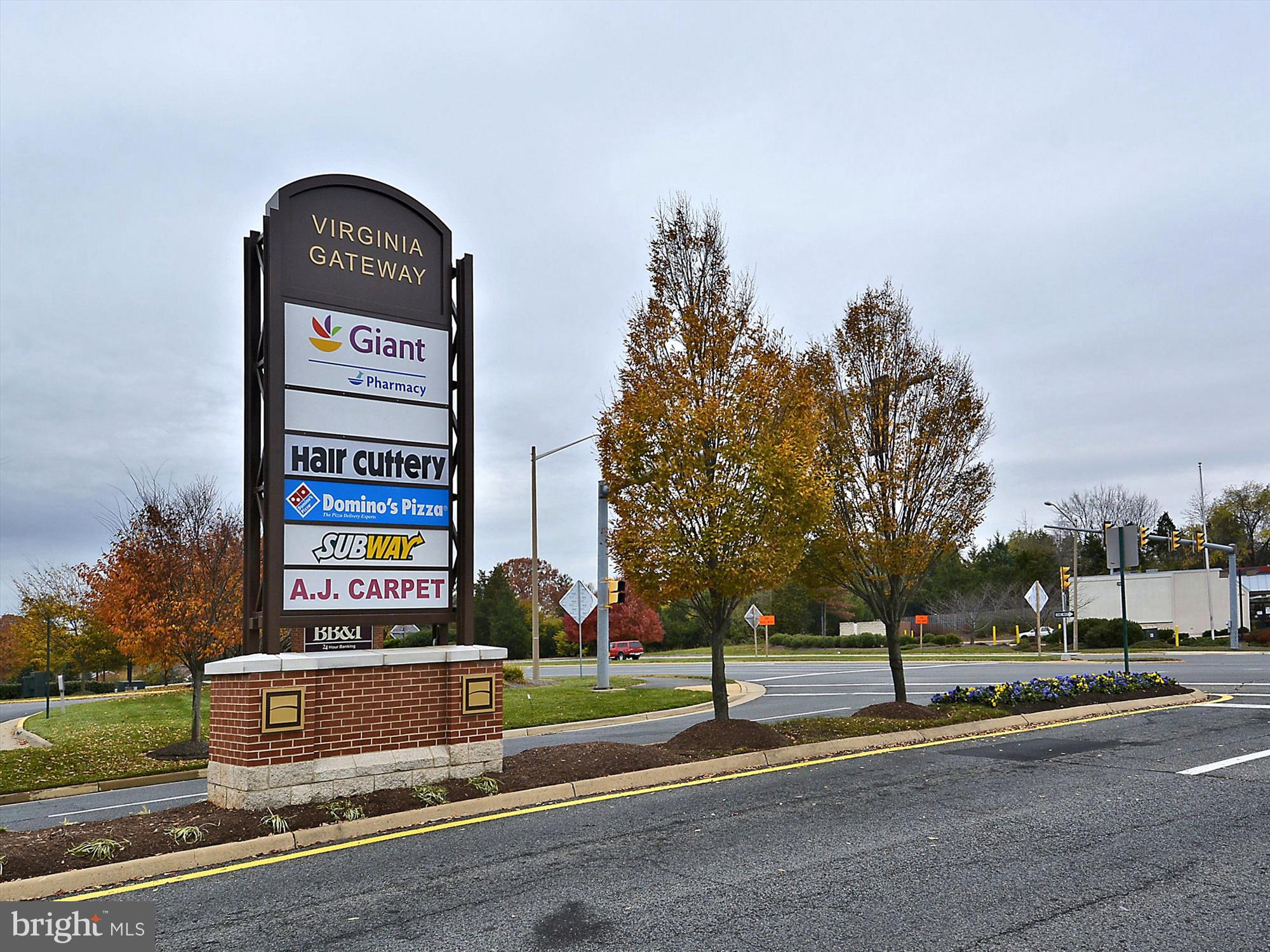 6688 Roderick Loop Gainesville, VA 20155 - Photo 36 of 40 a front view of a building with tree s