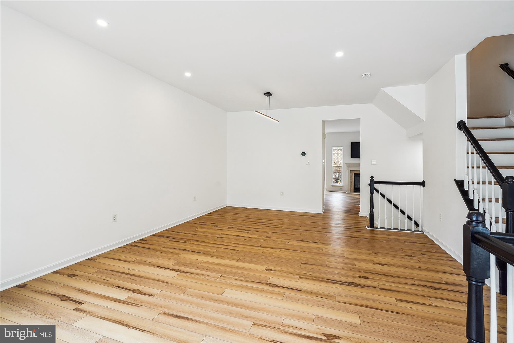 6688 Roderick Loop Gainesville, VA 20155 - Photo 6 of 40 a view of empty room with wooden floor