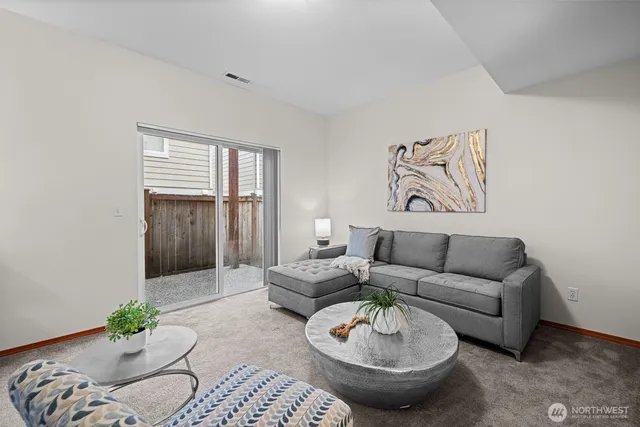a living room with furniture and a window