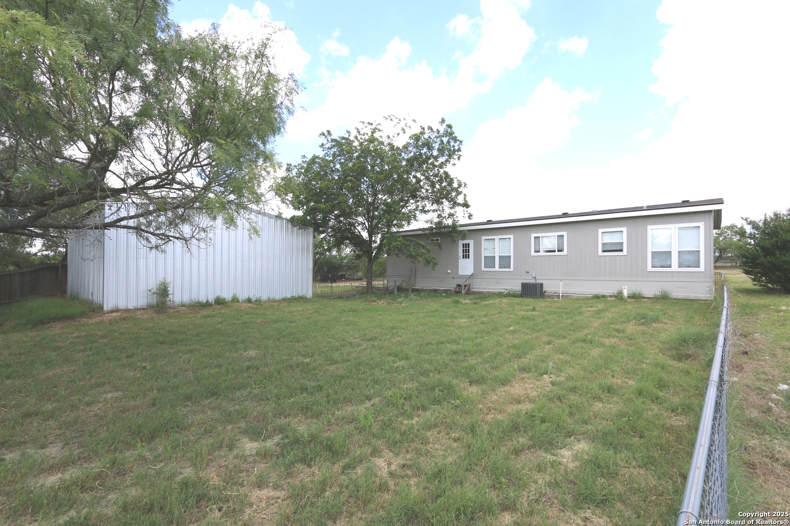 7510 Pittman Road Adkins, TX 78101 - Photo 11 of 42 a view of a house with a yard