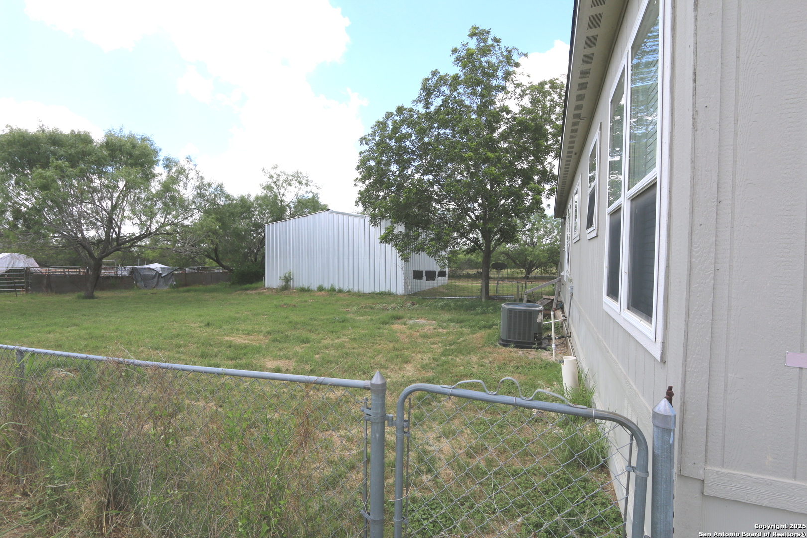 7510 Pittman Road Adkins, TX 78101 - Photo 13 of 42 a view of a house with a yard