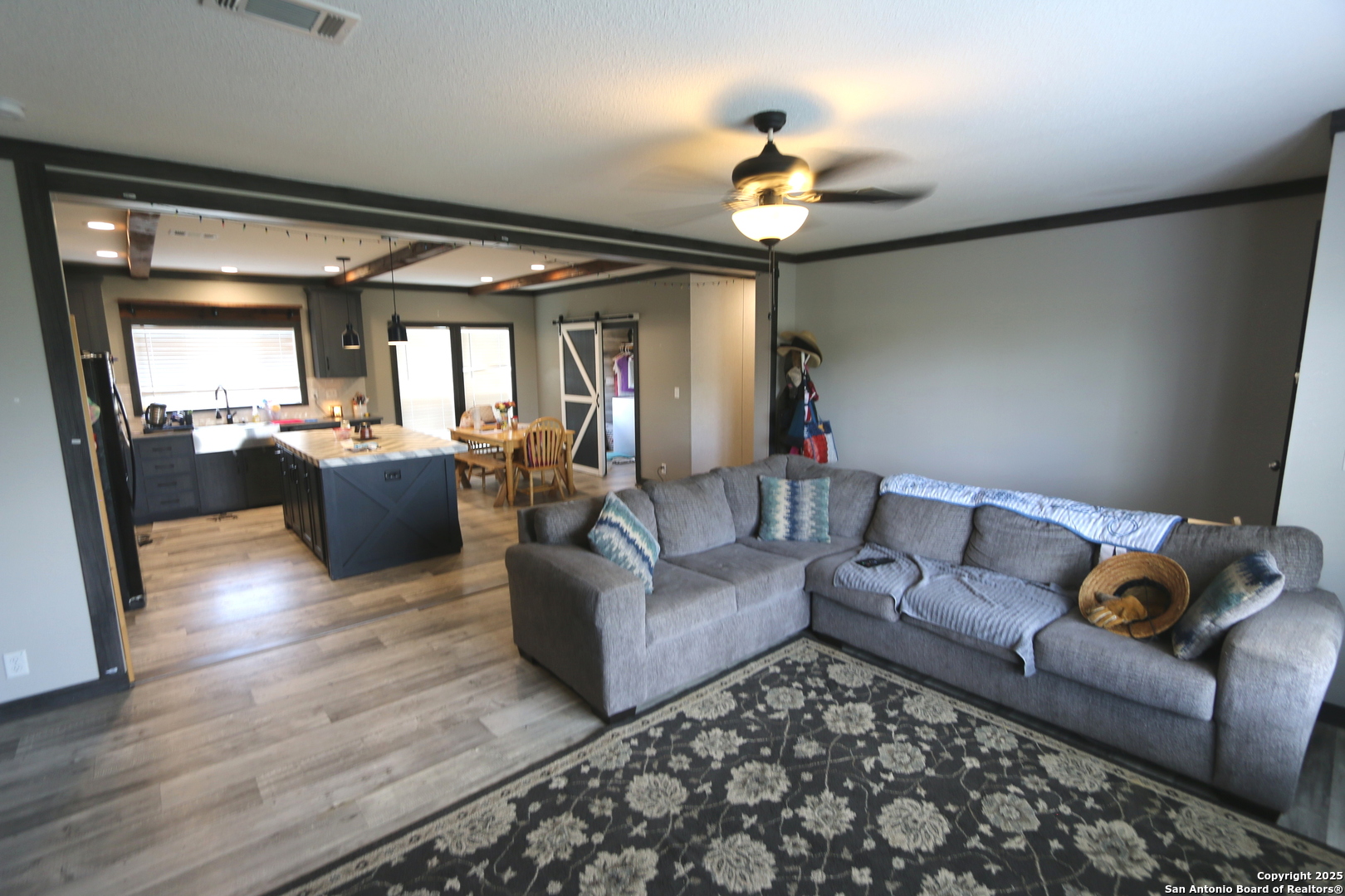 7510 Pittman Road Adkins, TX 78101 - Photo 15 of 42 a living room with furniture and a chandelier