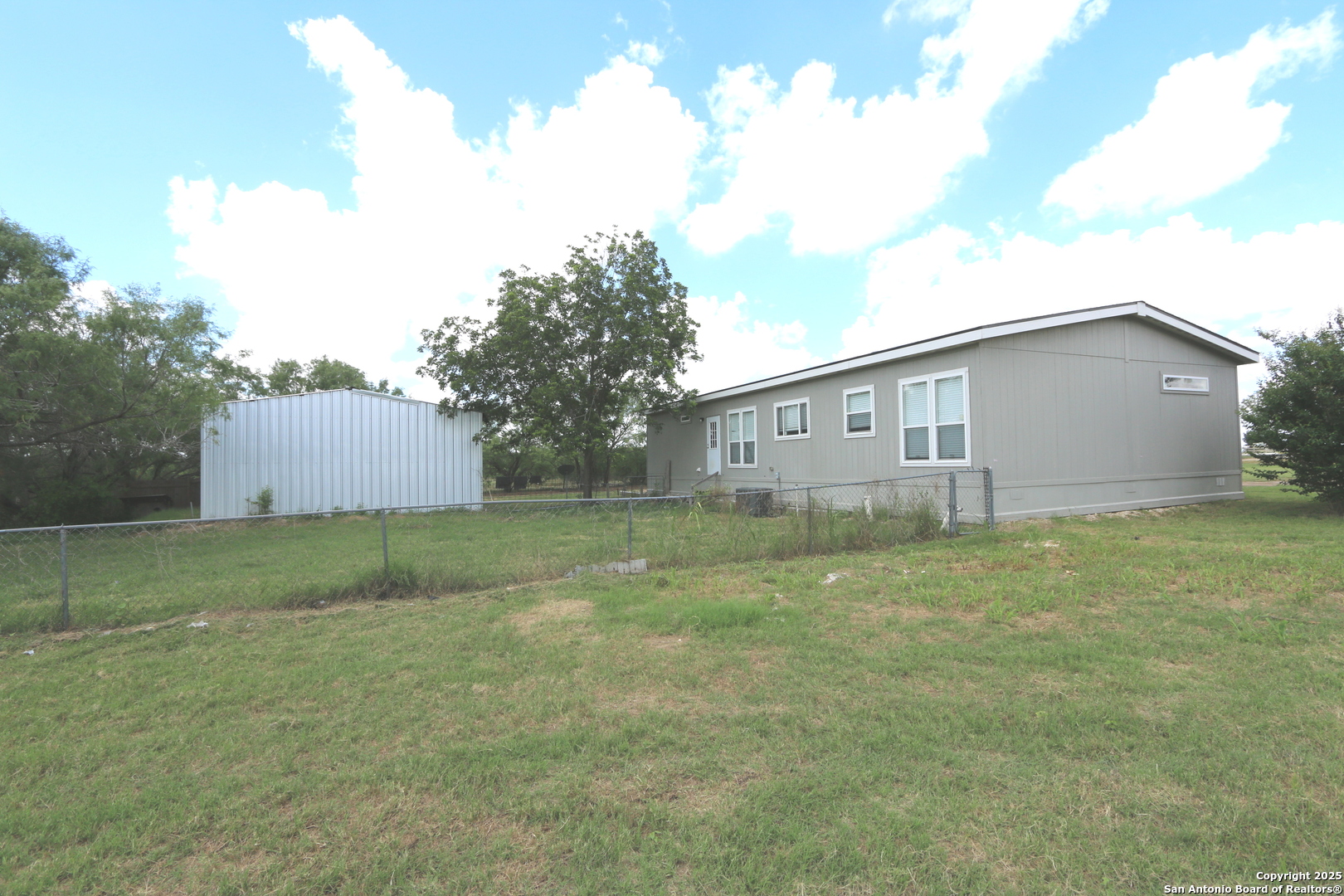 7510 Pittman Road Adkins, TX 78101 - Photo 2 of 42 a house view with backyard space