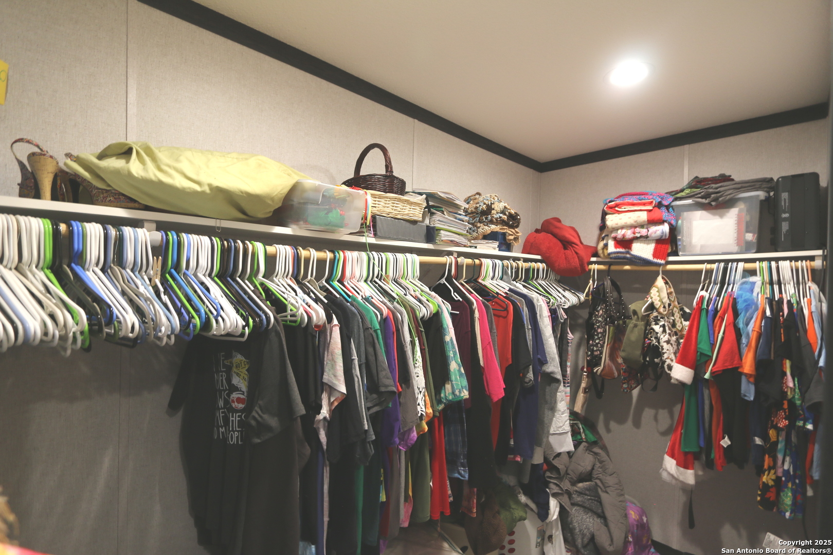 7510 Pittman Road Adkins, TX 78101 - Photo 28 of 42 a view of walk in closet with clothes