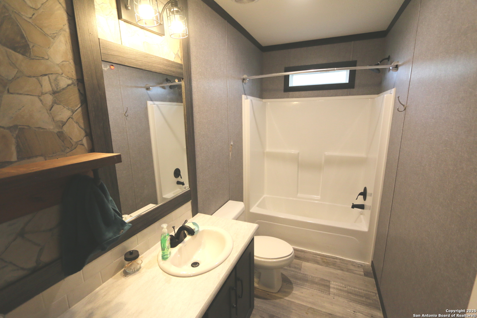 7510 Pittman Road Adkins, TX 78101 - Photo 30 of 42 a bathroom with a sink a toilet and shower