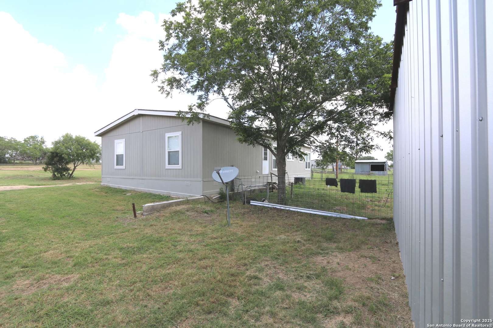 7510 Pittman Road Adkins, TX 78101 - Photo 31 of 42 a house view with a backyard space