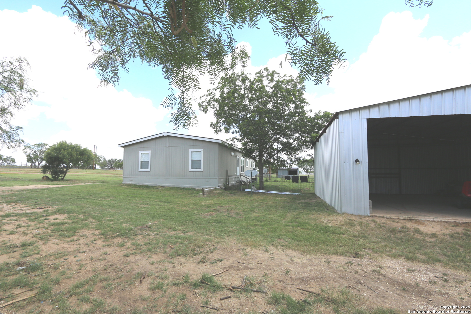 7510 Pittman Road Adkins, TX 78101 - Photo 33 of 42 a house view with garden space and trees