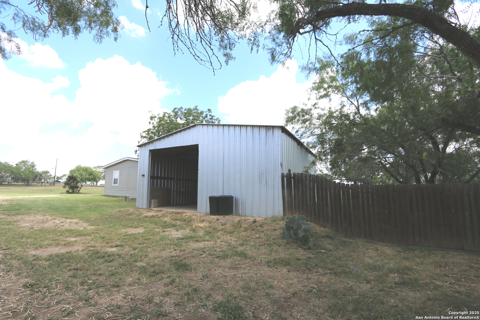 7510 Pittman Road Adkins, TX 78101 - Photo 34 of 42 a backyard of a house with lots of green space