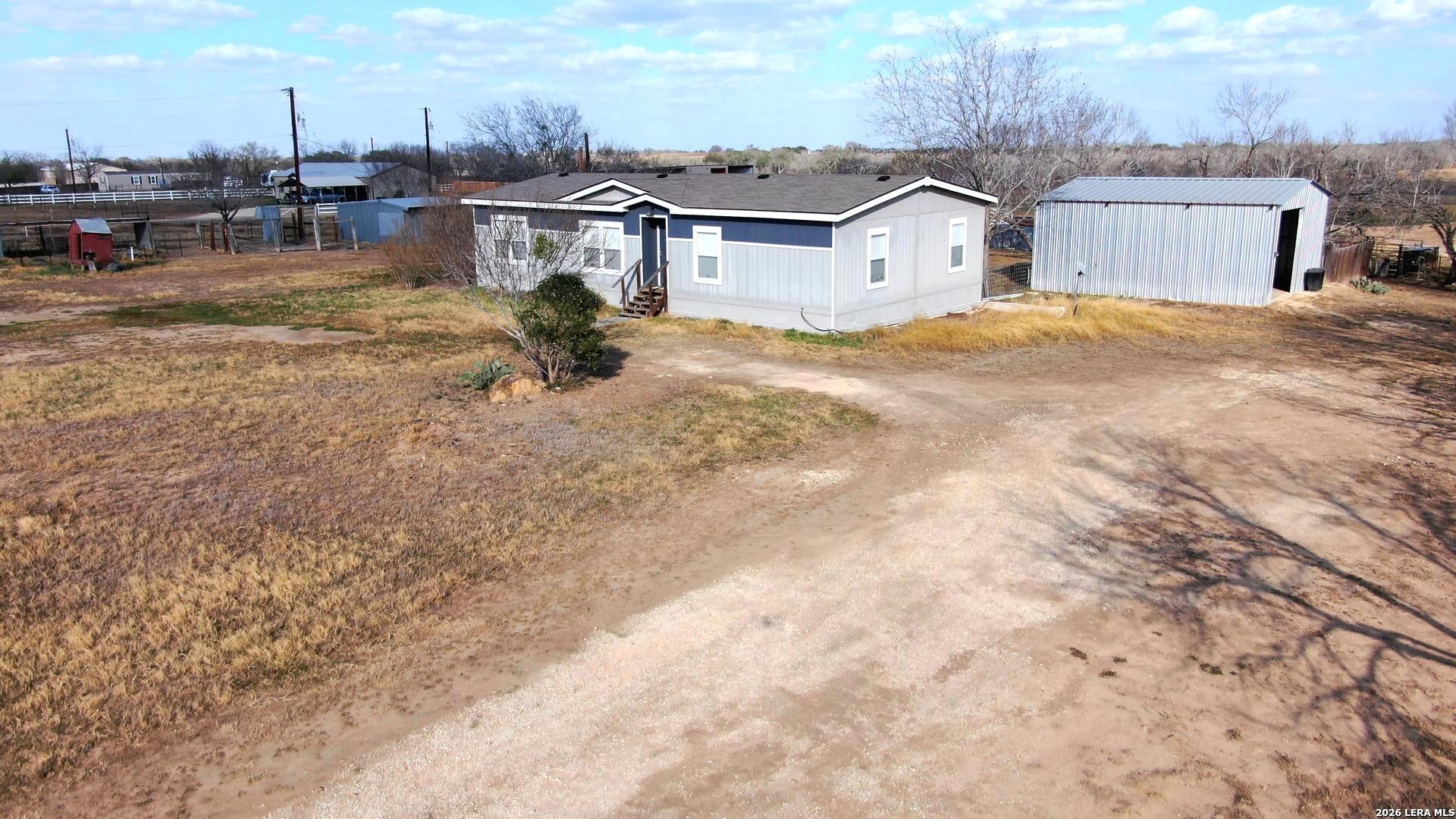 7510 Pittman Road Adkins, TX 78101 - Photo 5 of 42 a view of residential houses with yard