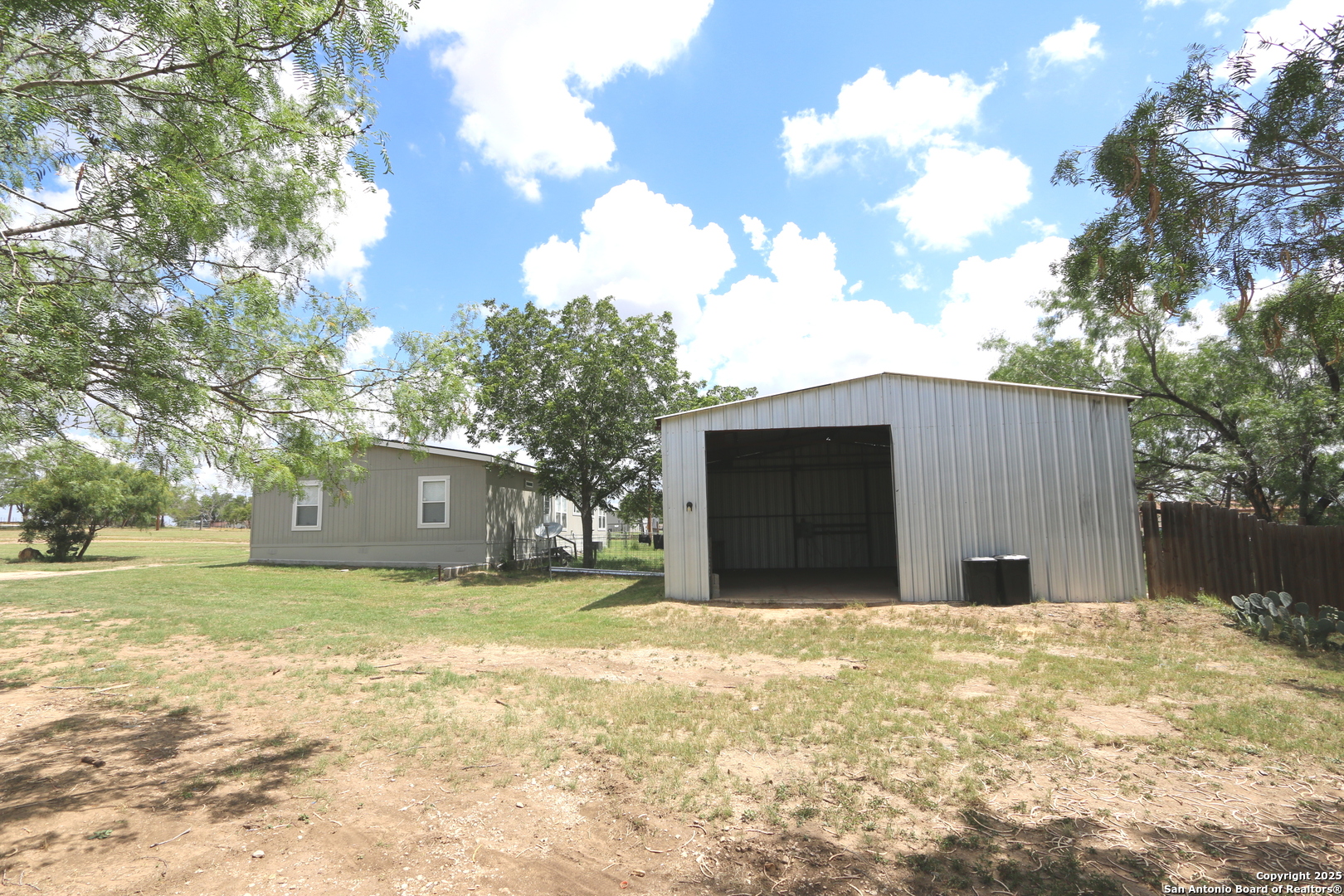 7510 Pittman Road Adkins, TX 78101 - Photo 6 of 42 a view of a house with a yard