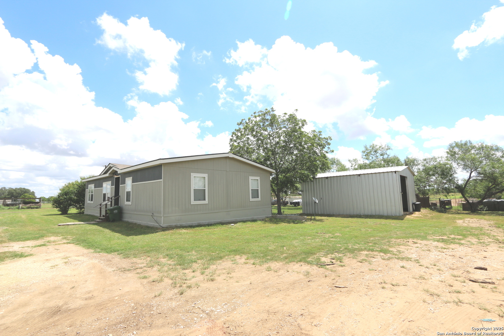 7510 Pittman Road Adkins, TX 78101 - Photo 8 of 42 a view of a house with a yard