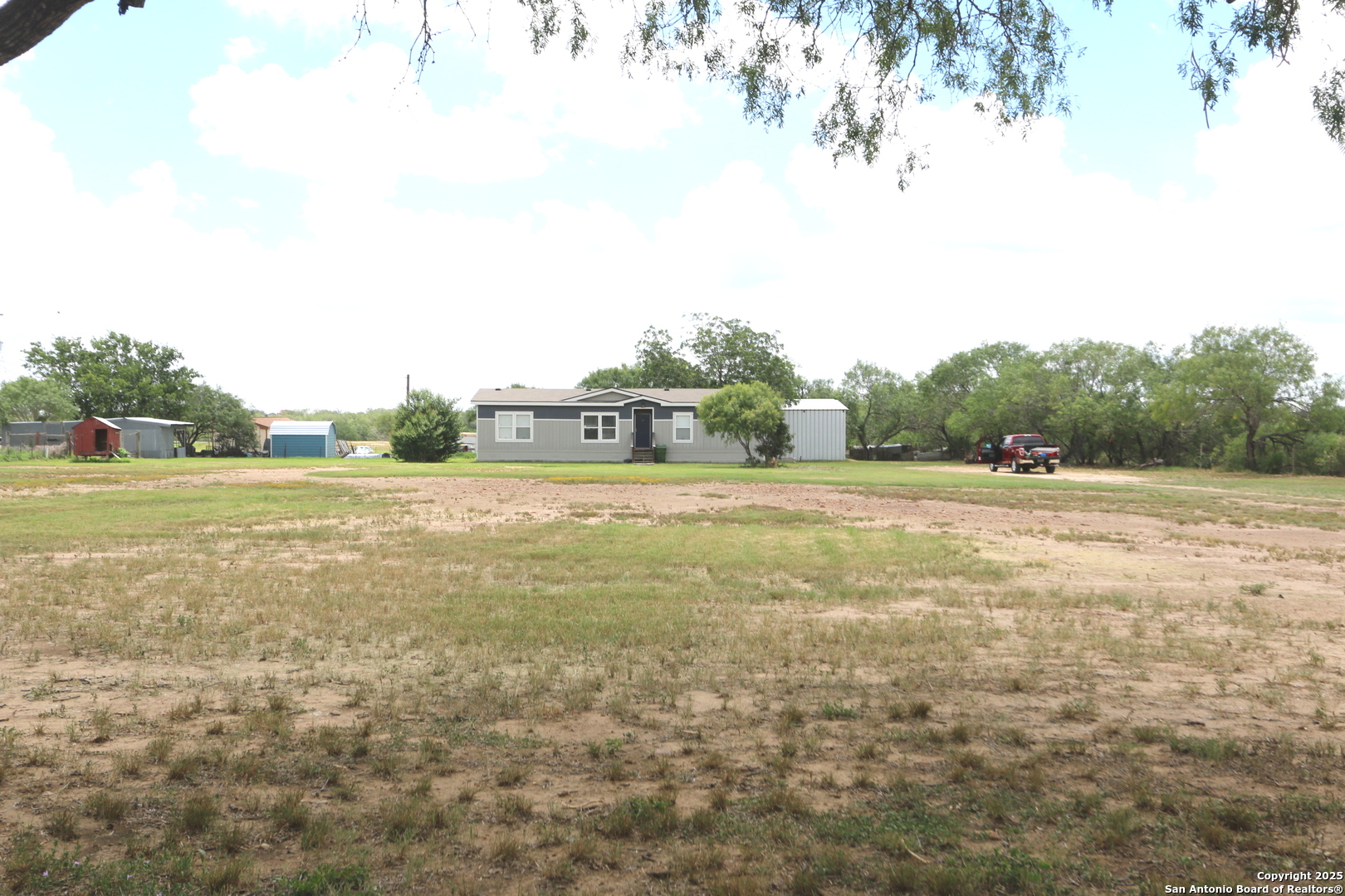 7510 Pittman Road Adkins, TX 78101 - Photo 9 of 42 a view of a field with trees in the background