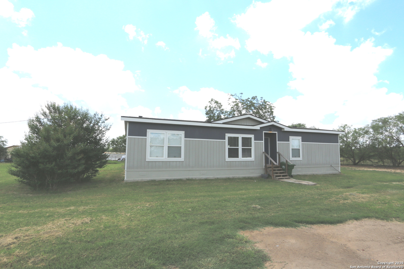 7510 Pittman Road Adkins, TX 78101 - Photo 10 of 42 a house that has a lot of windows in it