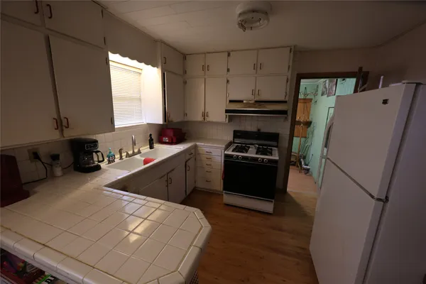 a living room with furniture gym equipment and a flat screen tv