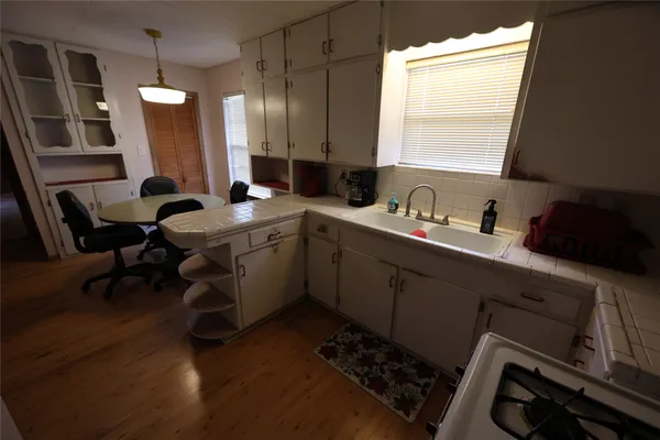 a bedroom with furniture and a window
