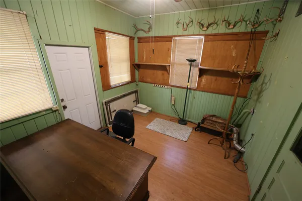a view of a hallway with seating area