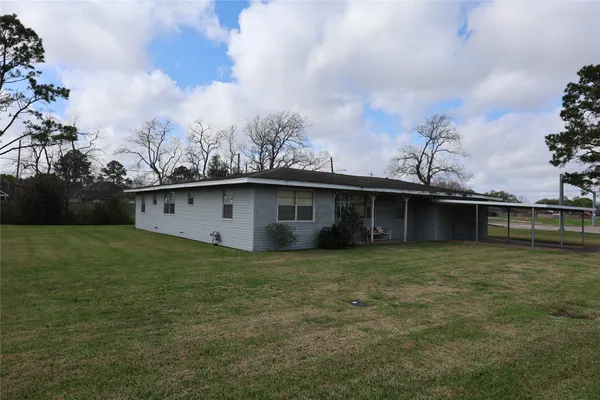 a backyard of a house with lots of green space