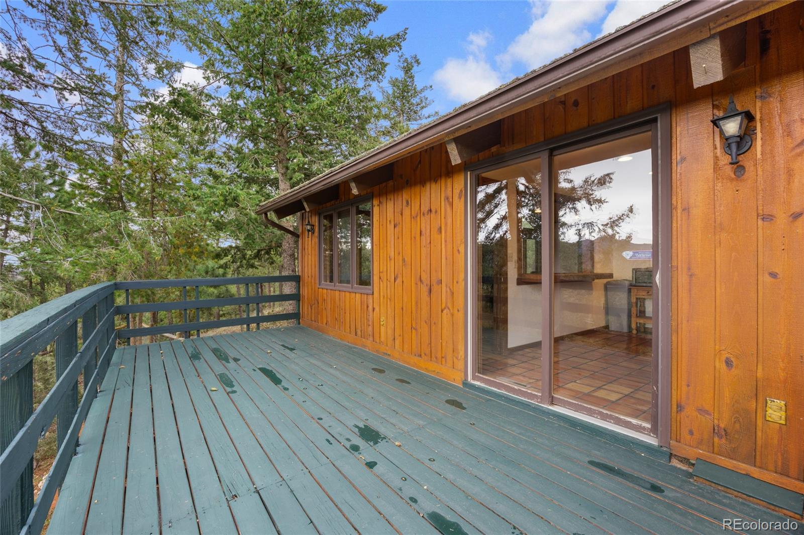 730 Clear Creek Road Evergreen, CO 80439 - Photo 12 of 44 a view of deck with wooden floor and outdoor space