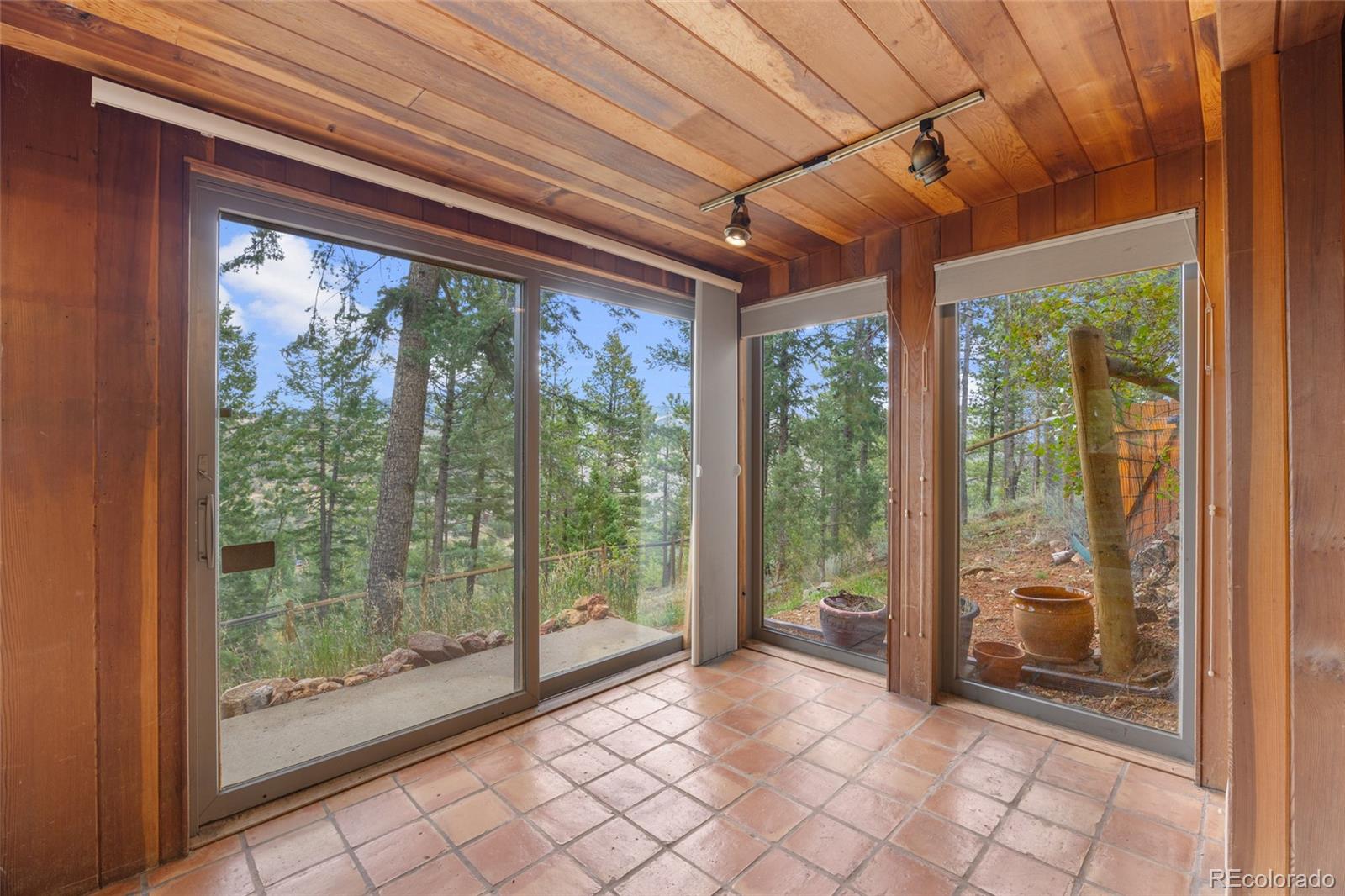 730 Clear Creek Road Evergreen, CO 80439 - Photo 35 of 44 a view of room with wooden floor and iron walls