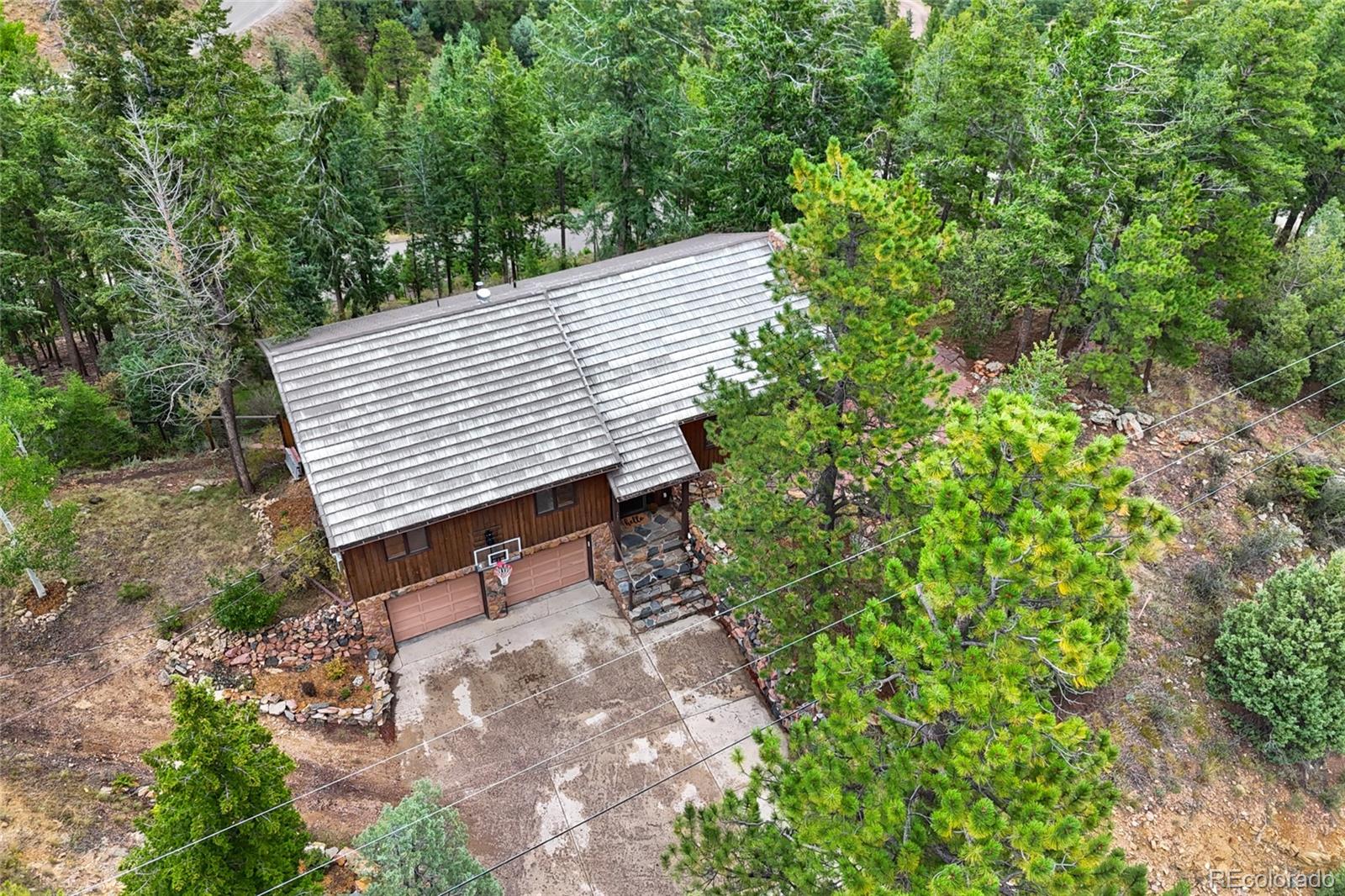 730 Clear Creek Road Evergreen, CO 80439 - Photo 43 of 44 a view of a backyard with sitting area