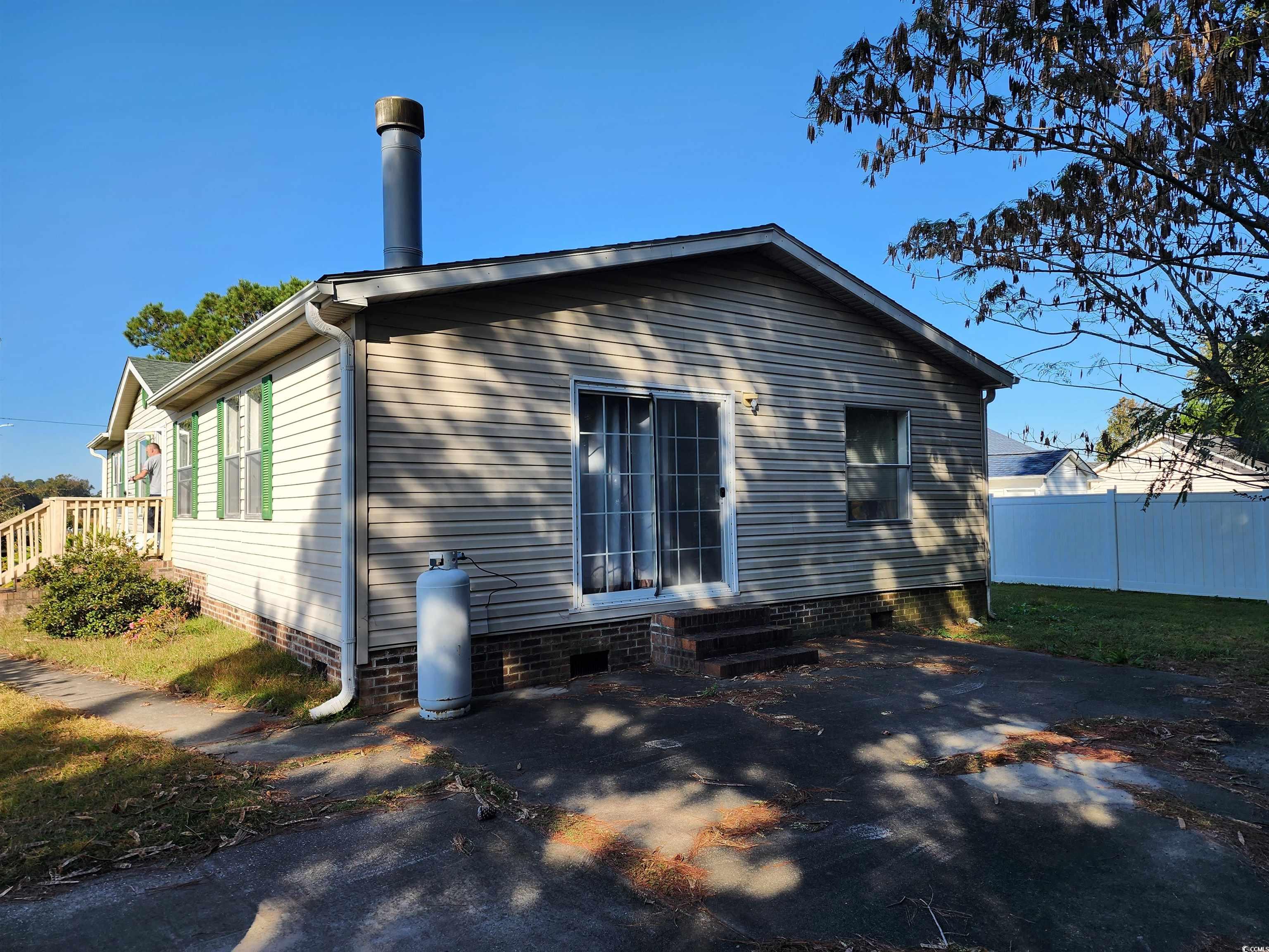 5160 Spring Street Loris, SC 29569 - Photo 6 of 18 Rear view of property featuring a patio area