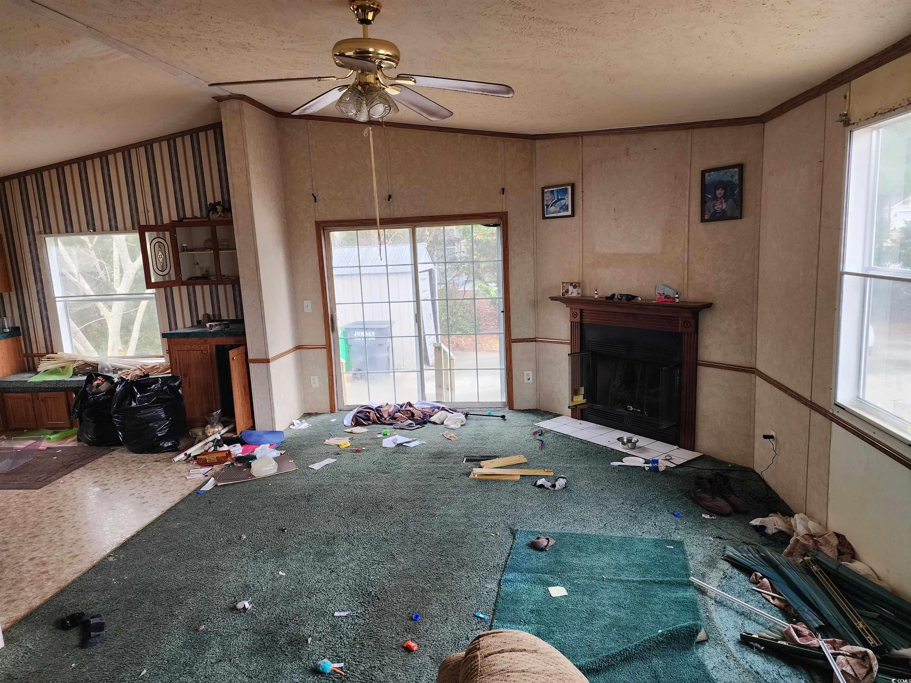 5160 Spring Street Loris, SC 29569 - Photo 8 of 18 Unfurnished living room featuring ceiling fan, a h