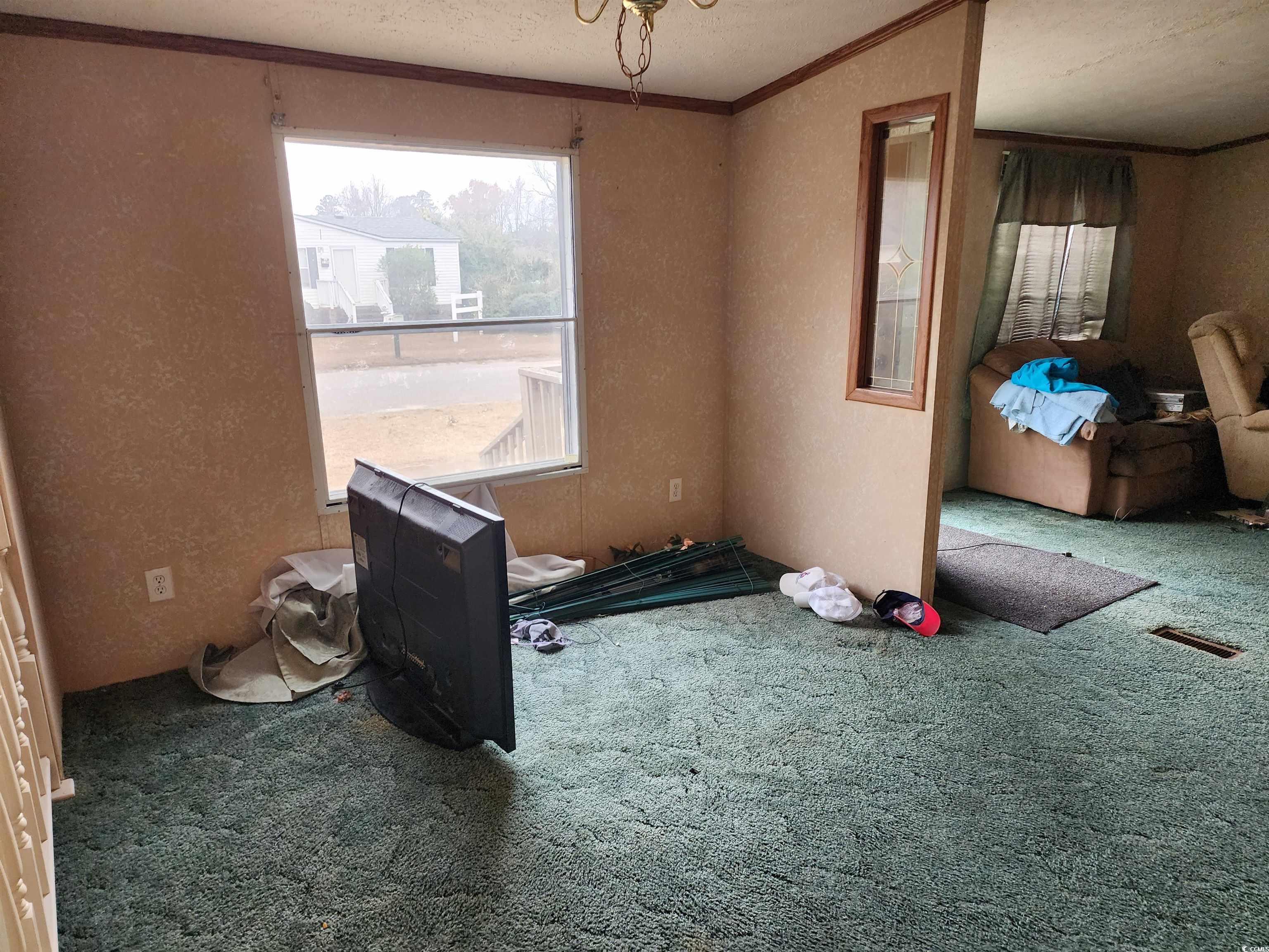 5160 Spring Street Loris, SC 29569 - Photo 9 of 18 Miscellaneous room with carpet flooring, crown mol