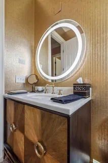 a bathroom with a sink and mirror