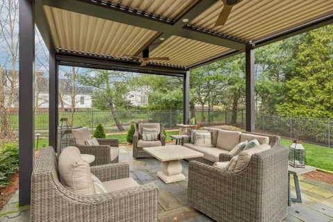 a outdoor living space with patio furniture and garden view